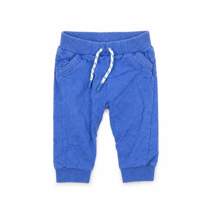 Front view of Mini Club boys’ blue jogger trousers, size 9, months