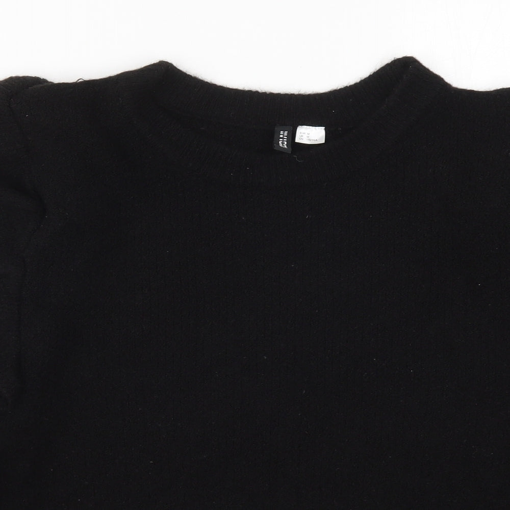 Close-up detail of H&M women’s black knit jumper, size M
