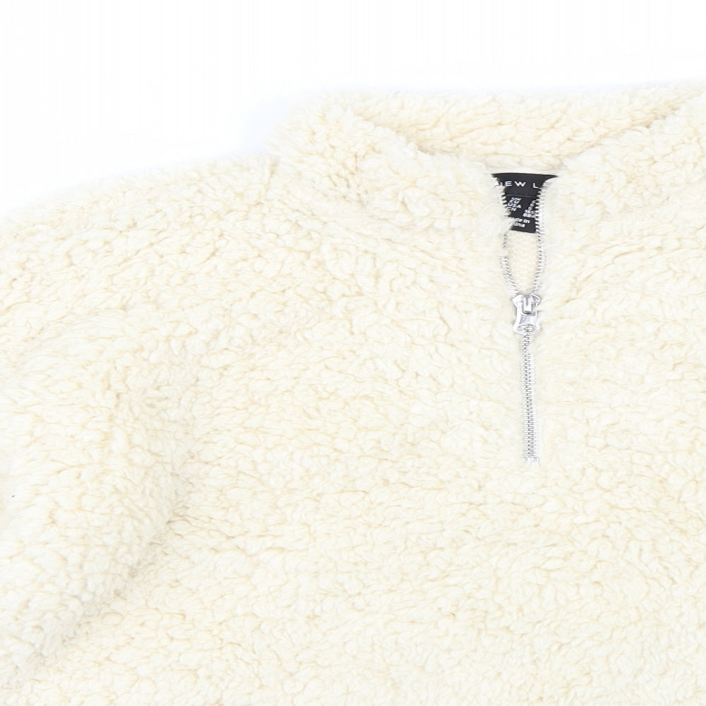 Close-up detail of New Look women’s beige pullover sweatshirt, size S