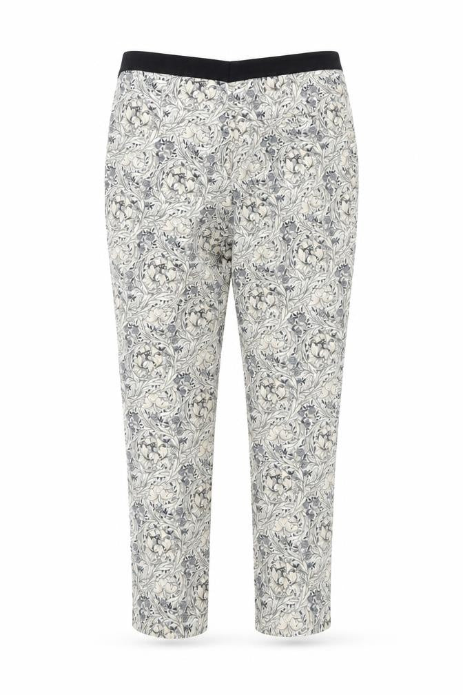 Front view of H&M women’s white floral trousers, size UK 31, in, 25-inch leg