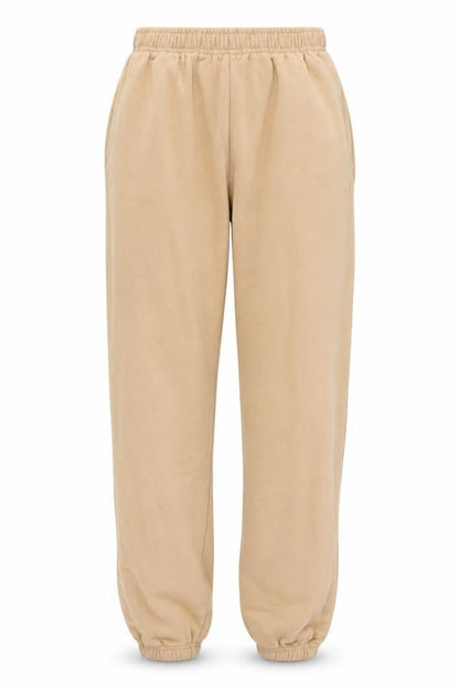 Front view of PRETTYLITTLETHING women’s brown sweatpants, size XS, 24-inch leg