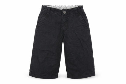 Front view of Next boys’ black cropped trousers, size 6, years