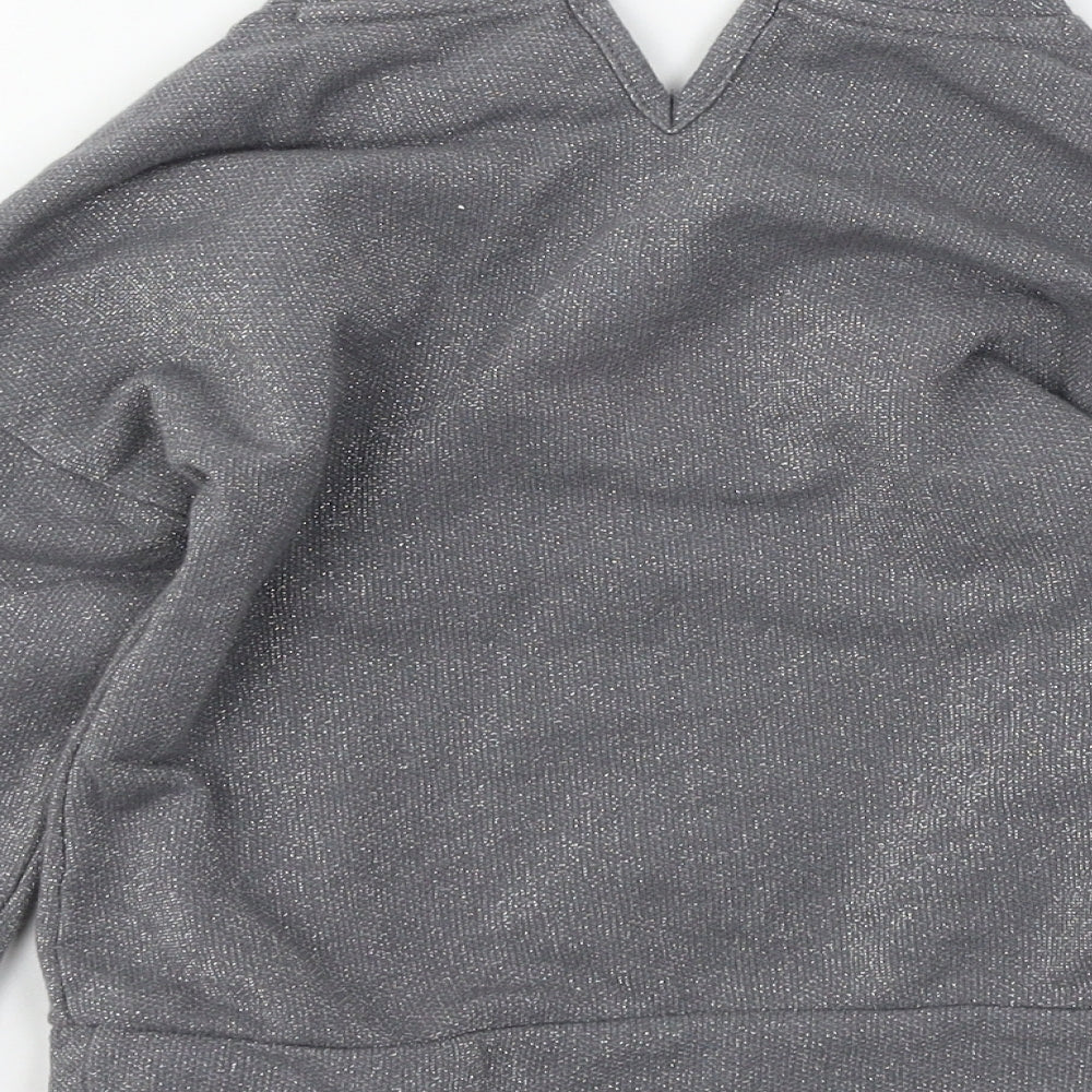 Brand and care label for Tu girls’ grey jersey pullover sweatshirt, size 7, years