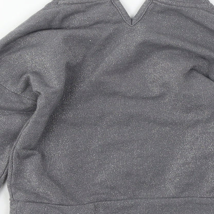 Brand and care label for Tu girls’ grey jersey pullover sweatshirt, size 7, years