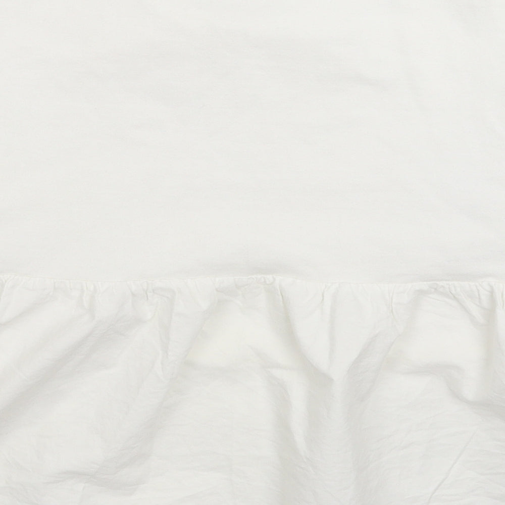 Brand and care label for Primark women’s white pullover sweatshirt, size UK 12