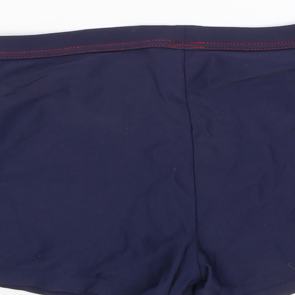 Brand and care label for Tu girls’ blue compression shorts, size 9, years