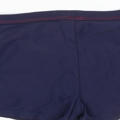 Brand and care label for Tu girls’ blue compression shorts, size 9, years