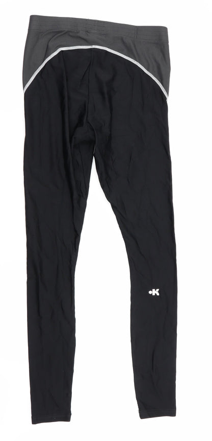 Back view of Kipsta women’s black compression leggings, size M, 28-inch leg
