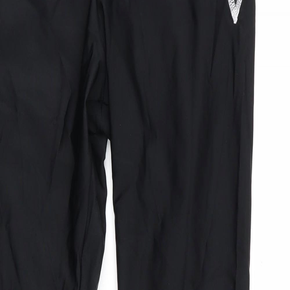 Close-up detail of Kipsta women’s black compression leggings, size M, 28-inch leg