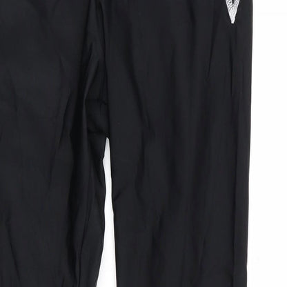 Close-up detail of Kipsta women’s black compression leggings, size M, 28-inch leg