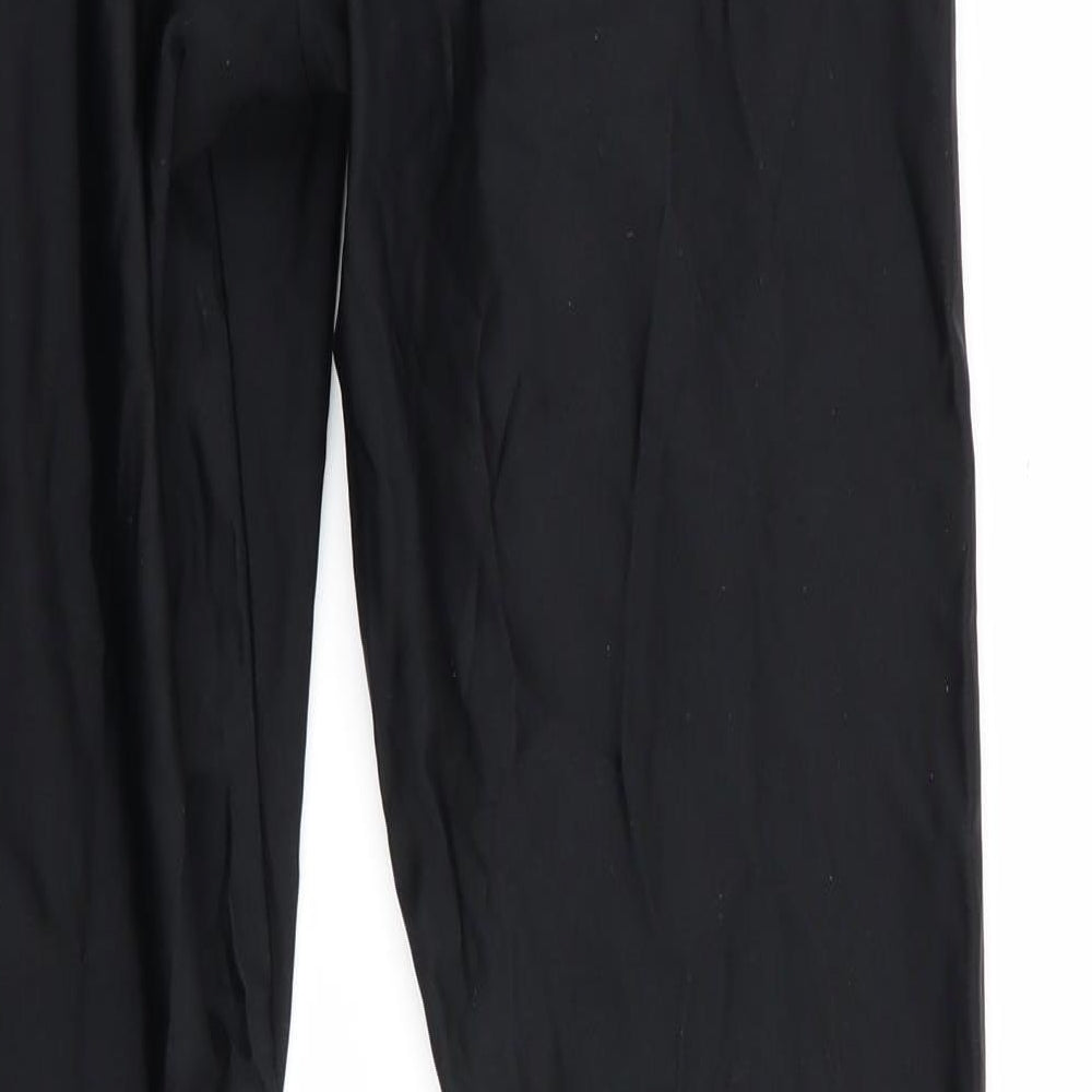 Brand and care label for Kipsta women’s black compression leggings, size M, 28-inch leg