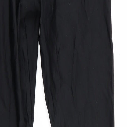 Brand and care label for Kipsta women’s black compression leggings, size M, 28-inch leg