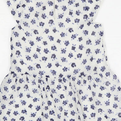 Brand and care label for George girls’ white floral basic blouse, size 8-9, years