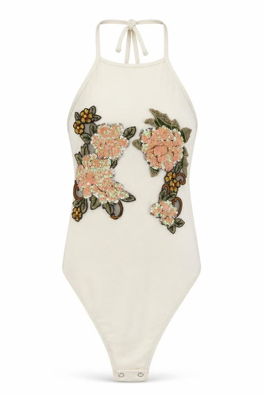 Front view of PRETTYLITTLETHING women’s white floral bodysuit one-piece, size UK 4