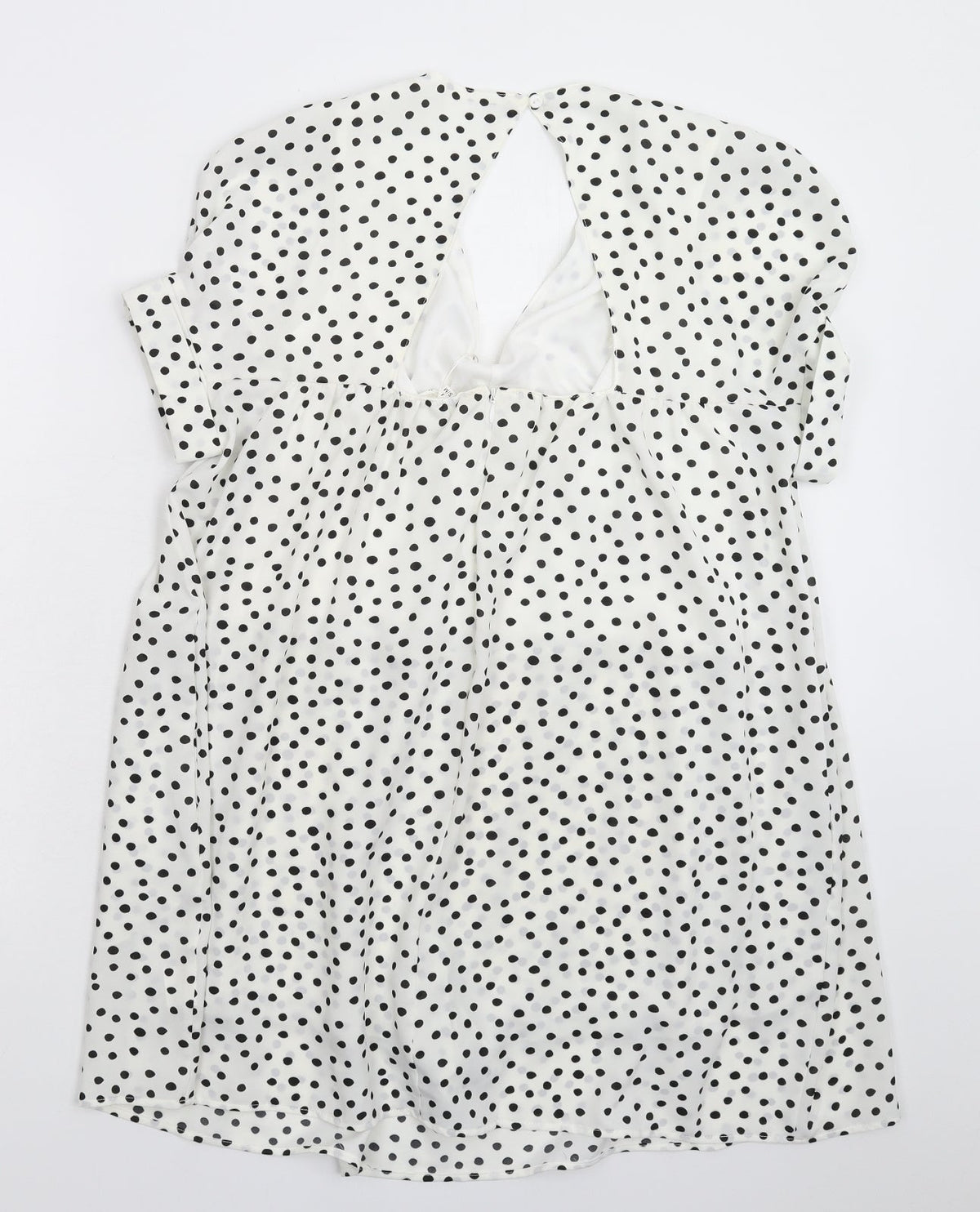 Back view of Kilky women’s white polka dot mini, size M