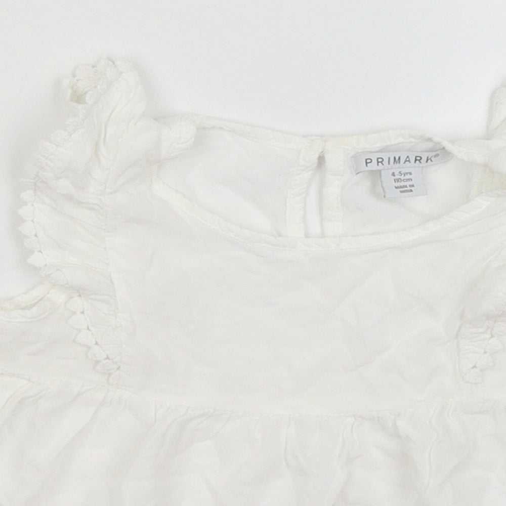 Close-up detail of Primark girls’ white basic blouse, size 4-5, years