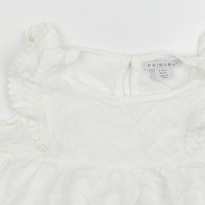 Close-up detail of Primark girls’ white basic blouse, size 4-5, years