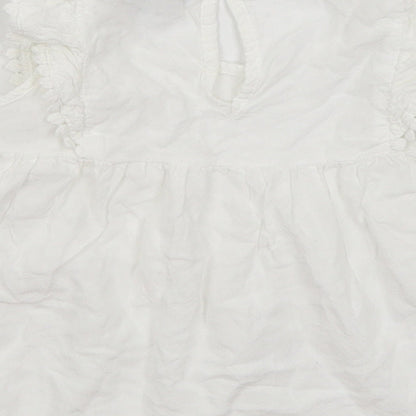 Brand and care label for Primark girls’ white basic blouse, size 4-5, years