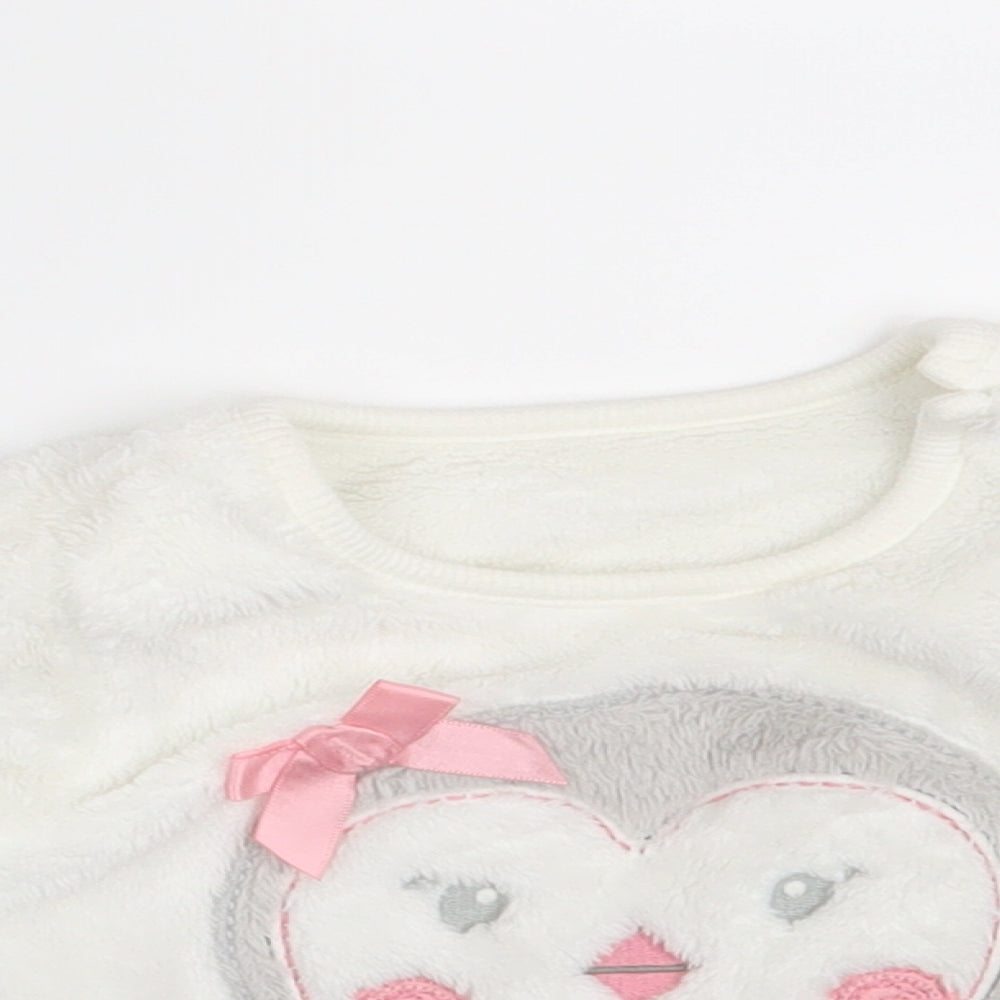 Close-up detail of George girls’ white jumper, size 6-9, months