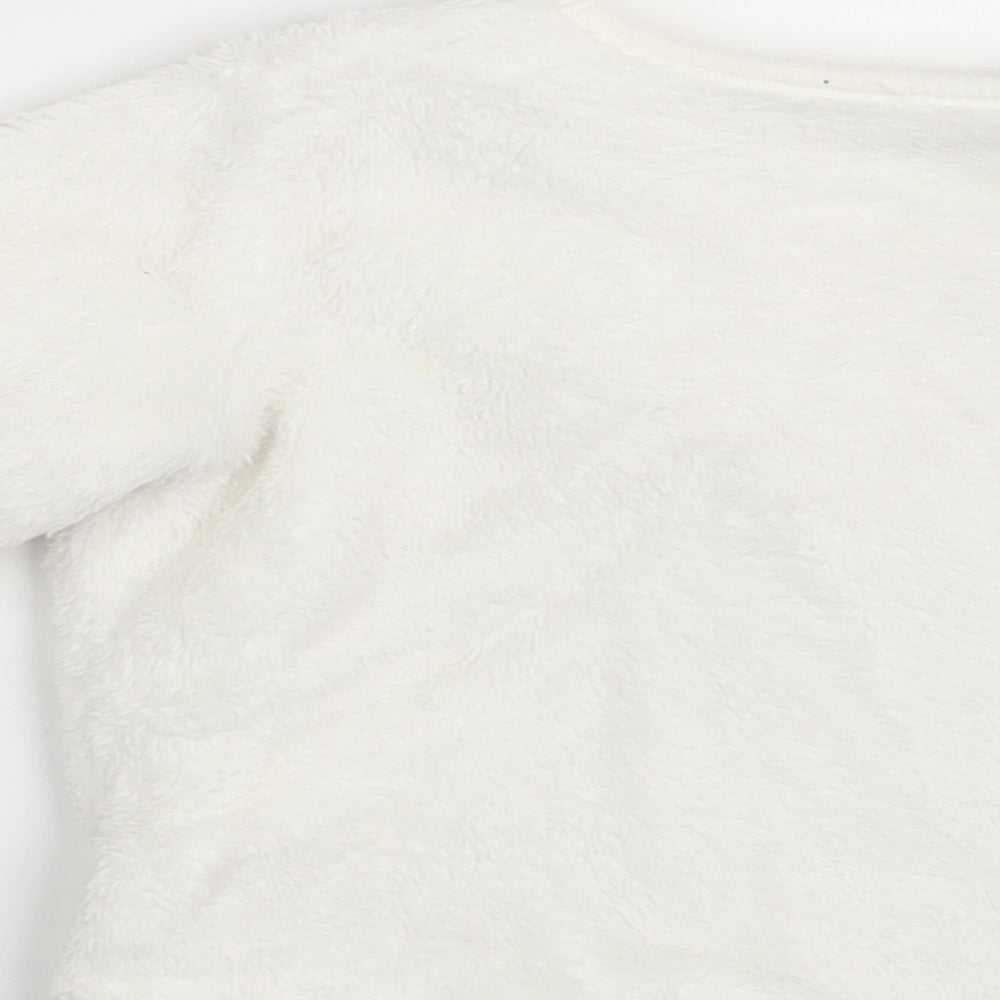 Brand and care label for George girls’ white jumper, size 6-9, months