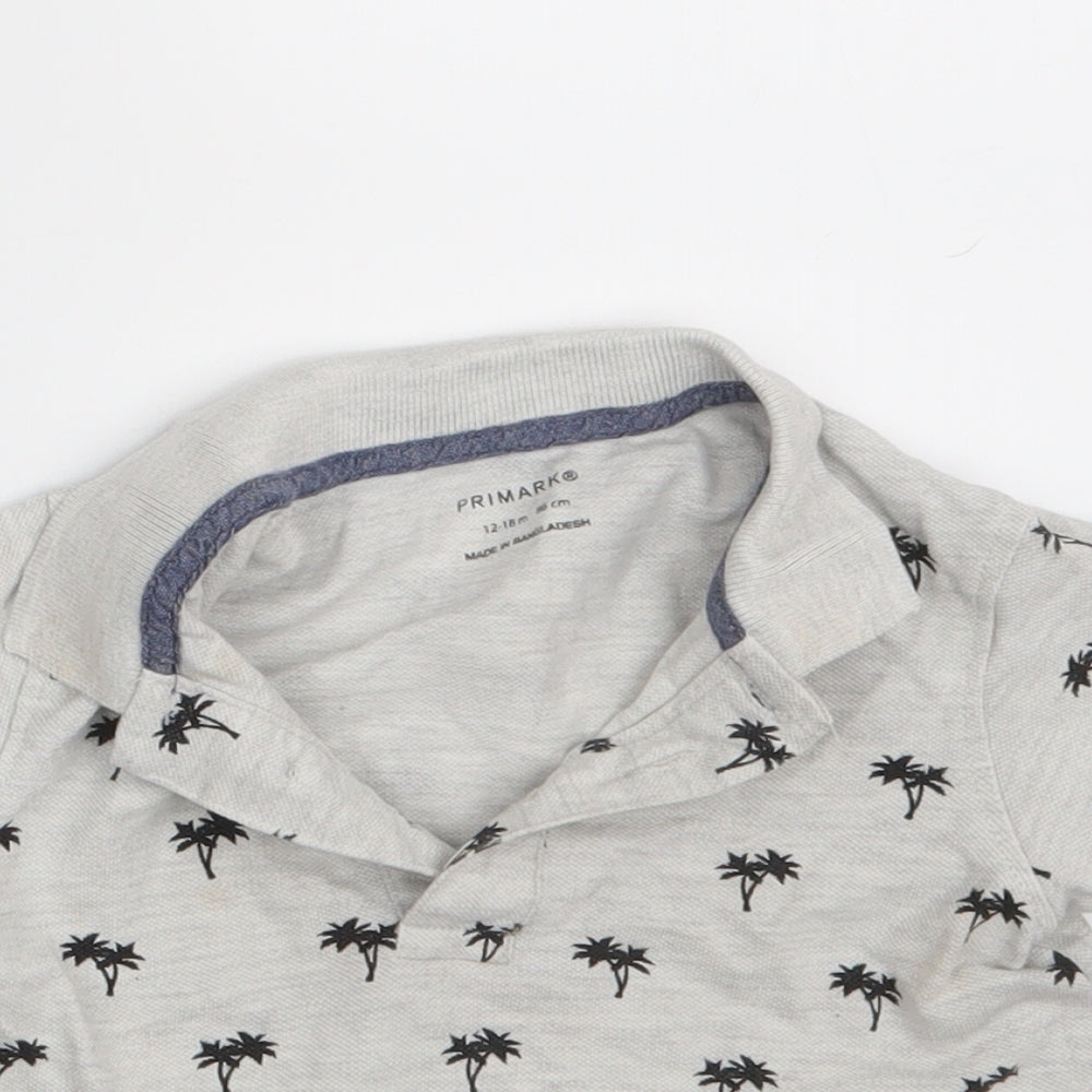 Close-up detail of Primark boys’ grey floral basic polo, size 12-18, months