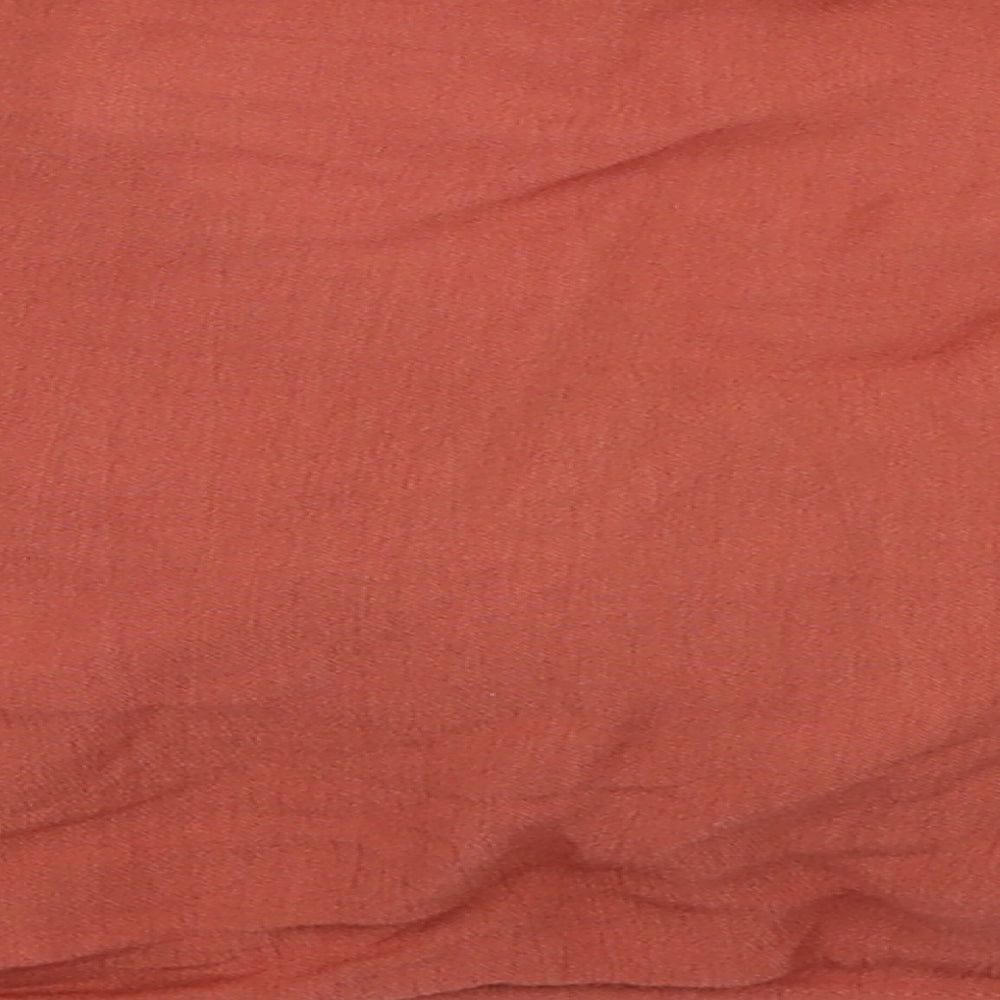 Brand and care label for Iisla & Bird women’s orange cropped blouse, size UK 6