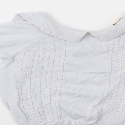Brand and care label for Caramelo boys’ blue jumper, size 2-3, years