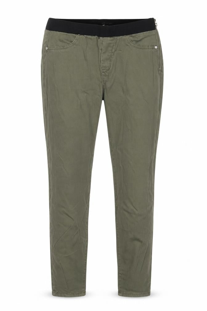 Front view of women’s green denim skinny jeans, size UK 28, in, 29-inch leg