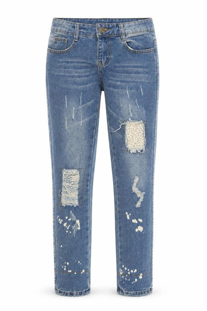Front view of women’s blue animal print denim skinny jeans, size S, 28-inch leg - leopard print