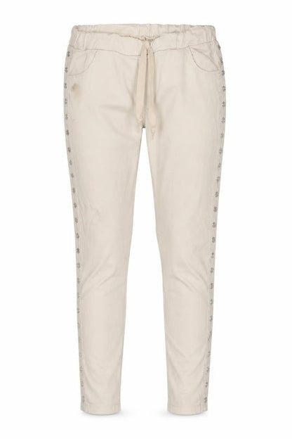 Front view of women’s beige skinny jeans, size UK 30, in, 26-inch leg - ring details