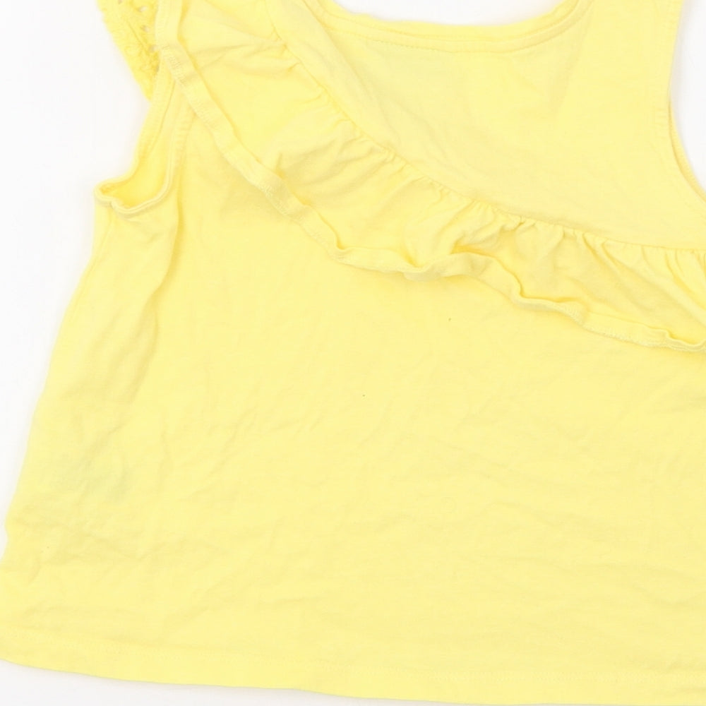 Brand and care label for Matalan girls’ yellow basic tank, size 7, years