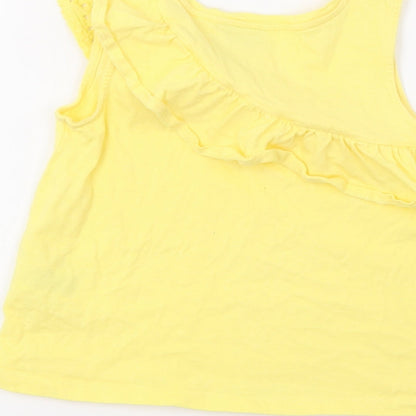 Brand and care label for Matalan girls’ yellow basic tank, size 7, years