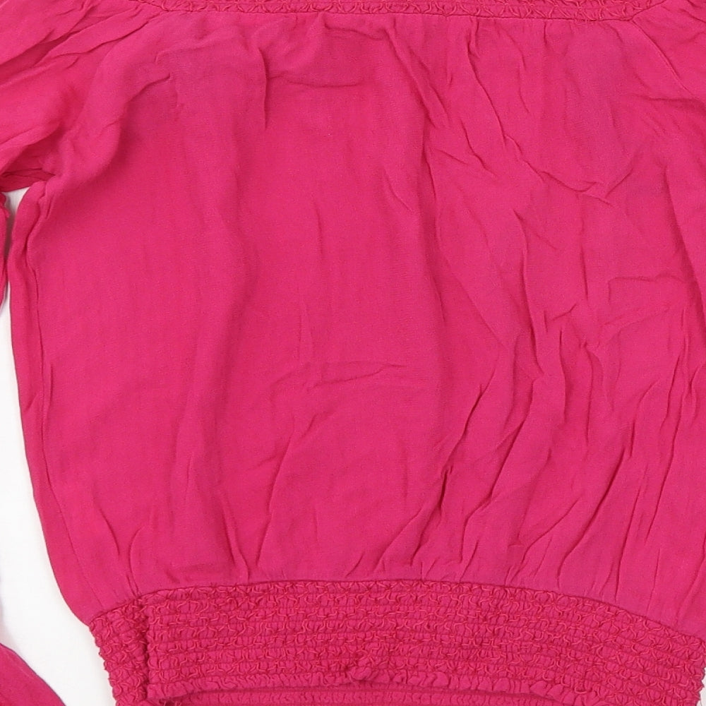 Brand and care label for XOXO women’s pink basic blouse, size S