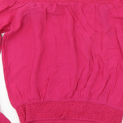 Brand and care label for XOXO women’s pink basic blouse, size S