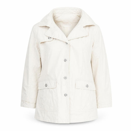 Front view of Betty Kay women’s beige polka dot rain coat coat, size UK 14