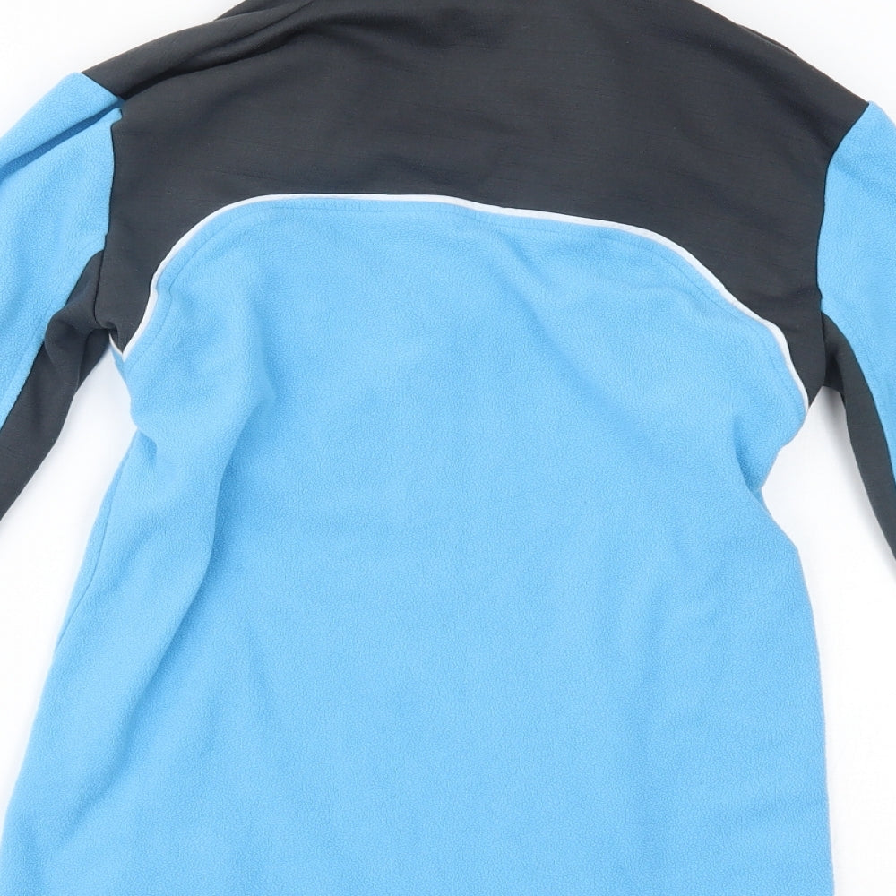 Brand and care label for Crane Sports women’s blue jumper, size S