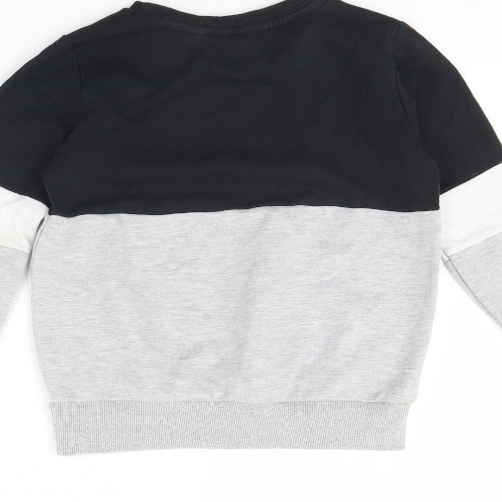 Brand and care label for FRIENDS boys’ grey jumper, size 7, years