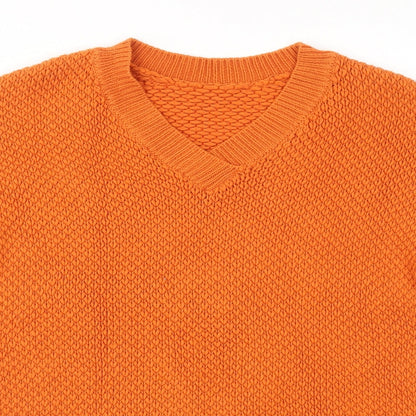 Close-up detail of Marks & Spencer women’s orange pullover sweatshirt, size UK 8