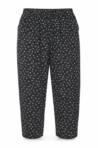 Front view of Emma Collection women’s black floral trousers, size XL, 23-inch leg