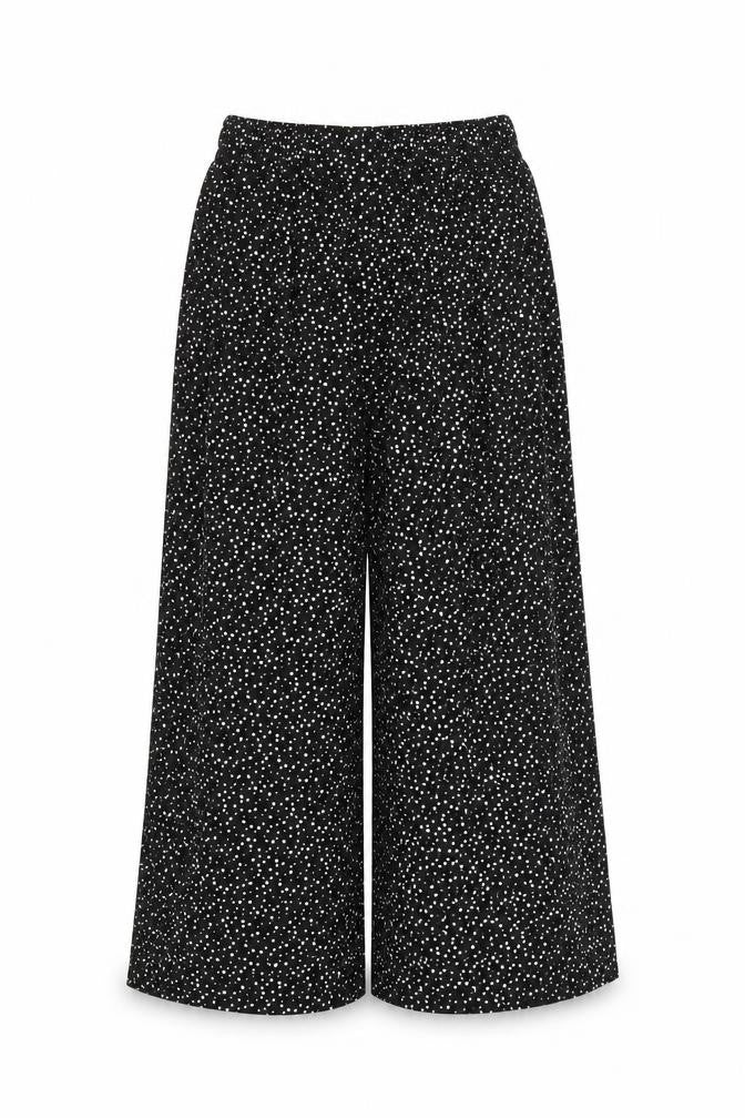 Front view of Preworn women’s black polka dot trousers, size S, 21-inch leg