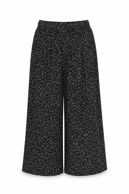 Front view of Preworn women’s black polka dot trousers, size S, 21-inch leg