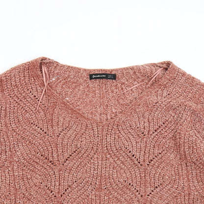 Close-up detail of Stadivarius women’s orange knit jumper, size S