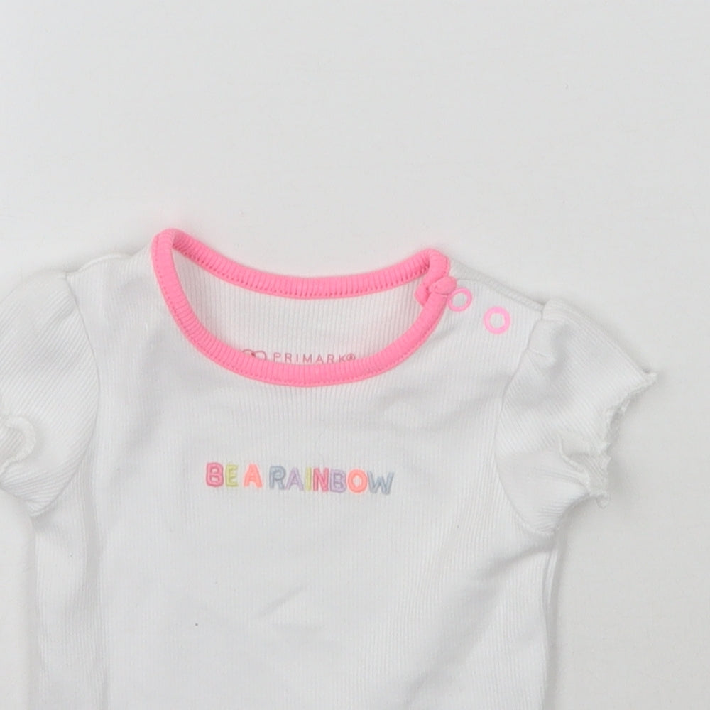 Close-up detail of Primark girls’ white basic t-shirt, size 0-3, months - be a rainbow