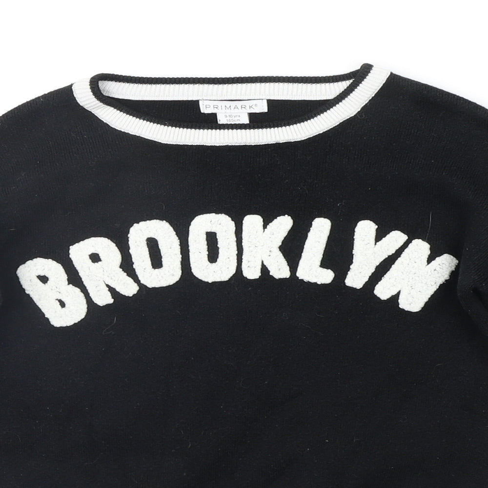 Close-up detail of Primark boys’ black jumper, size 9-10, years