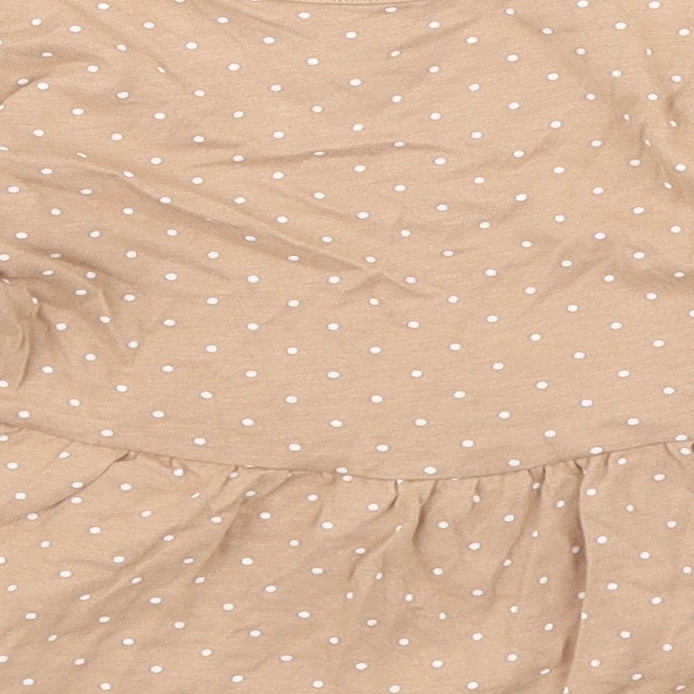 Brand and care label for George girls’ brown polka dot basic t-shirt, size 6-9, months