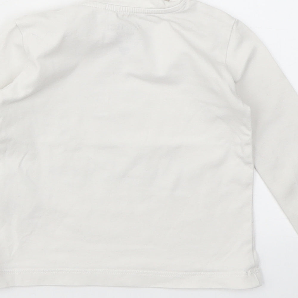 Brand and care label for PRIMIGI girls’ white geometric basic t-shirt, size 10, years