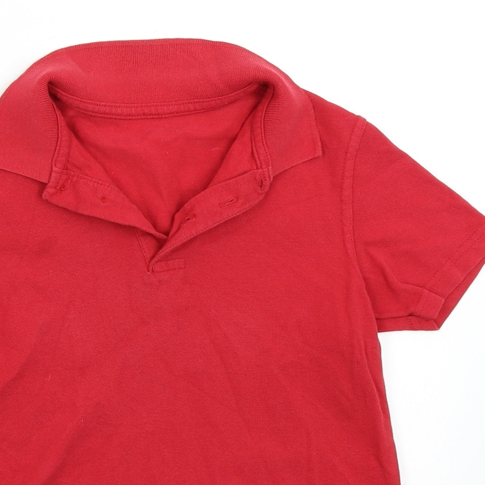 Close-up detail of George boys’ red basic polo, size 7-8, years
