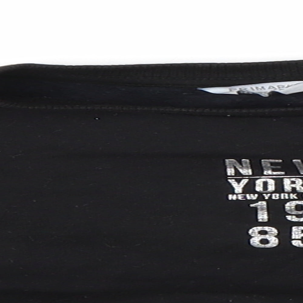 Close-up detail of Primark girls’ black jumper, size 8-9, years