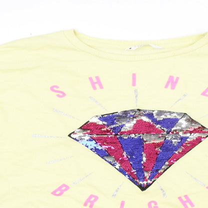 Close-up detail of Candy Couture girls’ yellow pullover sweatshirt, size 13, years