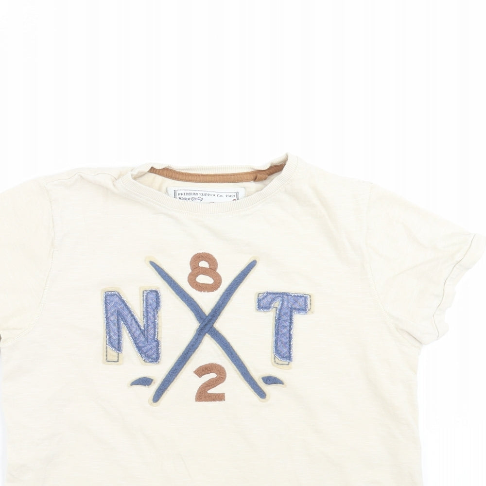 Close-up detail of Next boys’ beige basic t-shirt, size 9, years - embroidered detail